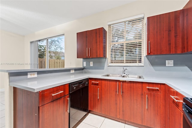 kitchen featuring black appliances, light tile patterned floors, and sink