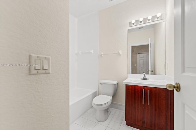 bathroom featuring tile patterned flooring, vanity, and toilet