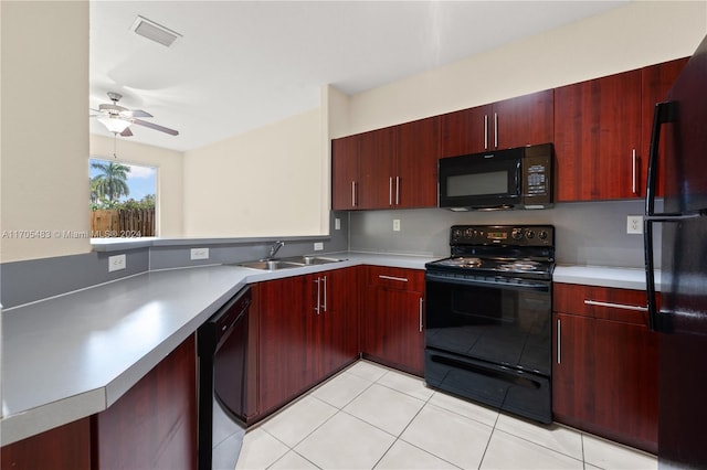 kitchen featuring black appliances, sink, ceiling fan, light tile patterned floors, and kitchen peninsula