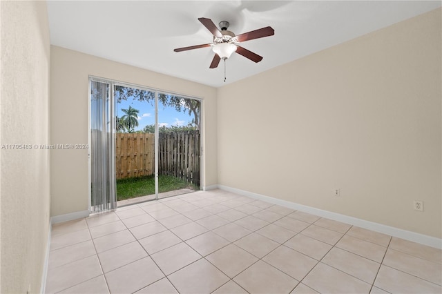 tiled empty room with ceiling fan