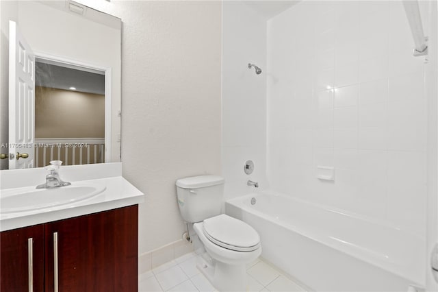 full bathroom featuring vanity, tile patterned flooring, tiled shower / bath, and toilet