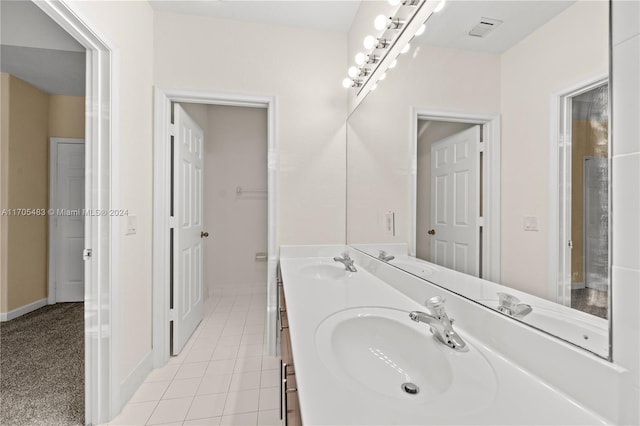 bathroom with tile patterned floors and vanity