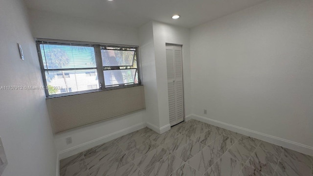 unfurnished bedroom featuring a closet