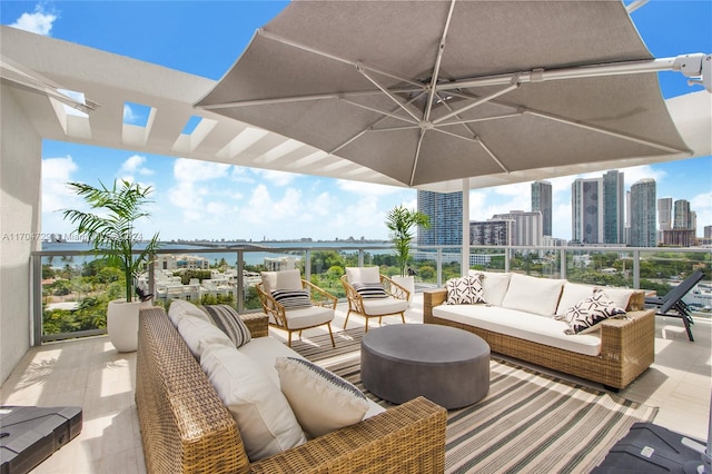 view of patio / terrace featuring an outdoor living space and a water view