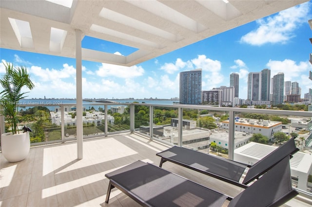 balcony featuring a water view