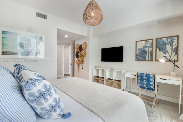 bedroom with wood-type flooring