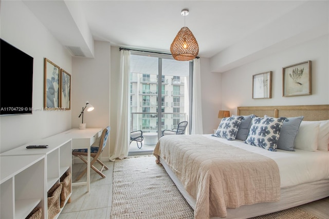 bedroom with light tile patterned floors