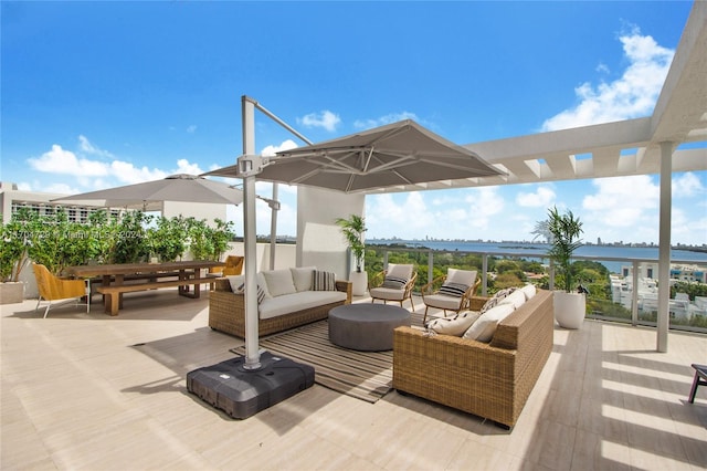 view of patio / terrace with a water view and an outdoor hangout area