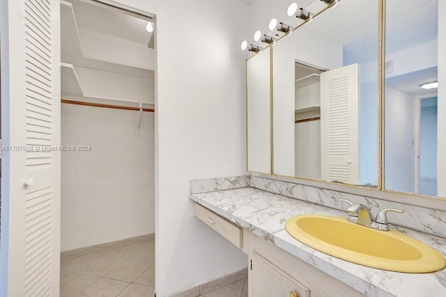 bathroom with tile patterned floors and vanity