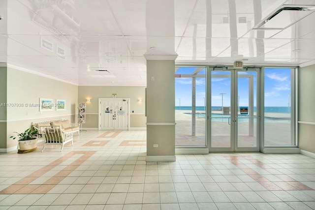 common area featuring a view of the beach and a water view