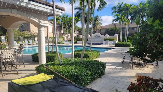 view of swimming pool with a patio area