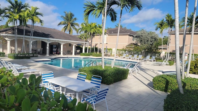 view of swimming pool with a patio area