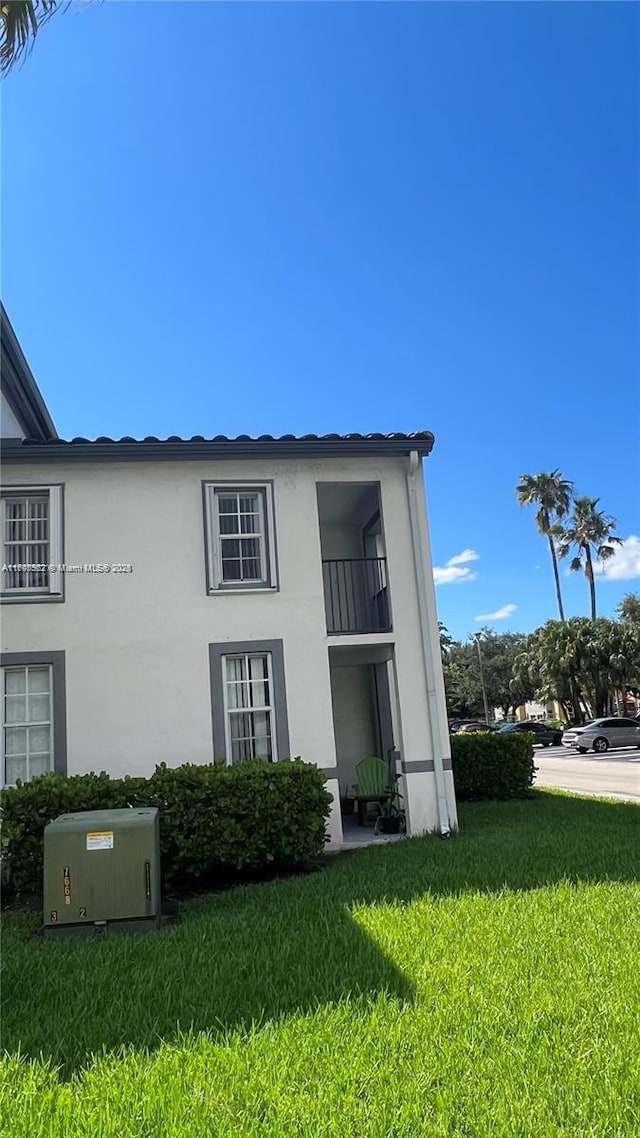 view of home's exterior featuring a yard