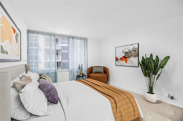 bedroom with light tile patterned floors