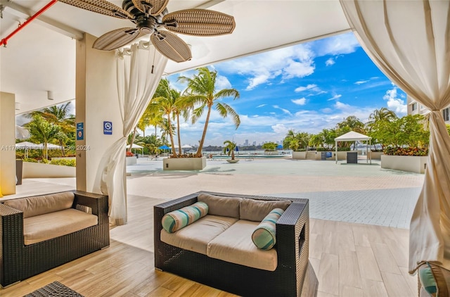 view of patio / terrace featuring ceiling fan and an outdoor hangout area