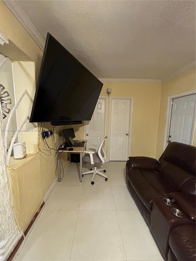 office featuring crown molding, light tile patterned floors, and a textured ceiling