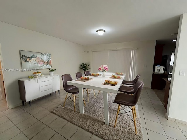 dining space with light tile patterned floors