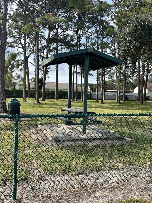 4575 Gladiator Cir, Green Acres, FL 33463 - surrounding community featuring a gate