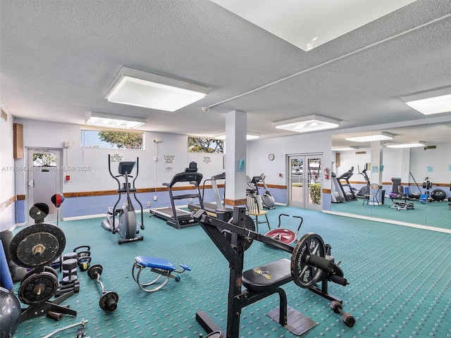 exercise room featuring a wealth of natural light, french doors, carpet floors, and a textured ceiling