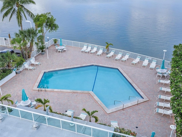 view of pool featuring a water view