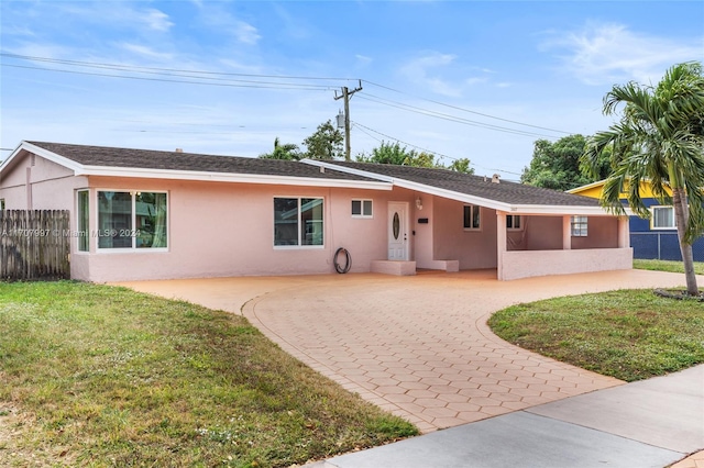 ranch-style house with a front yard