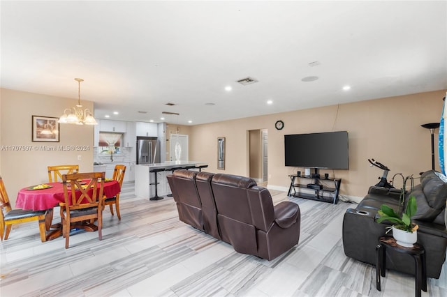 living room featuring a chandelier