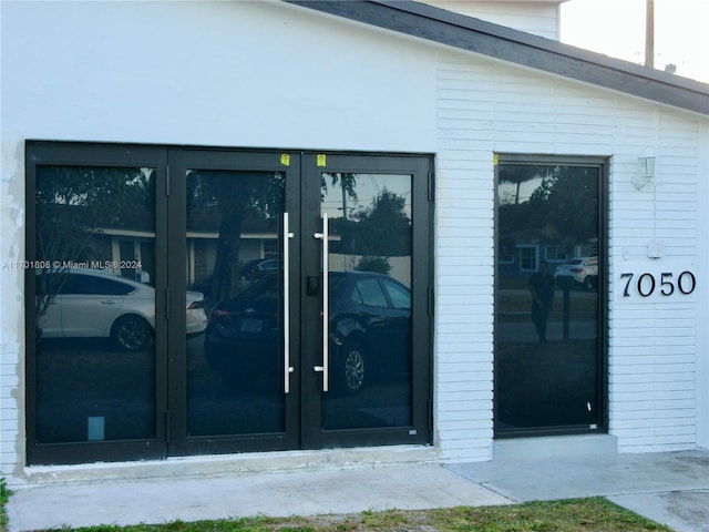 property entrance featuring french doors