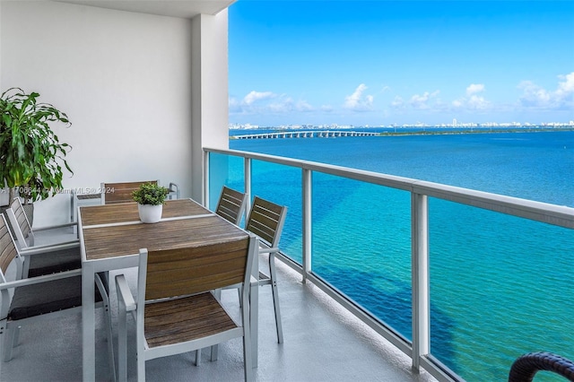 balcony featuring a water view