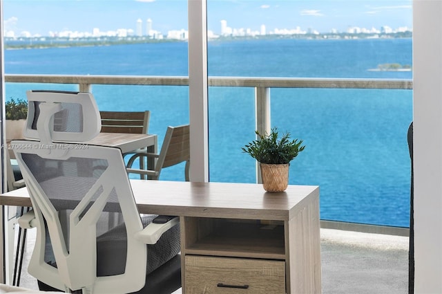 balcony featuring a water view