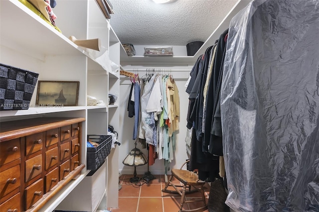 spacious closet featuring light tile patterned flooring