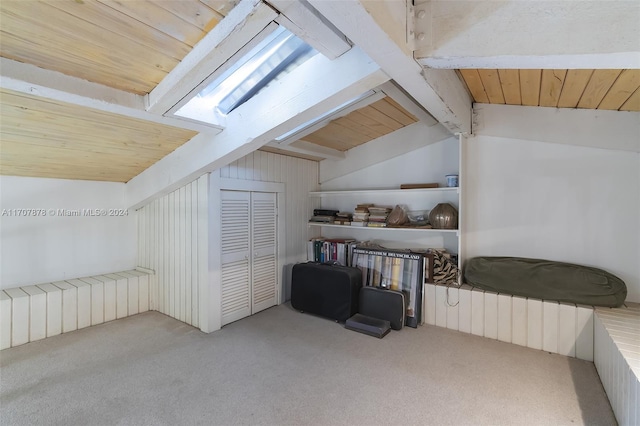 bonus room with vaulted ceiling with beams, light colored carpet, and wooden ceiling