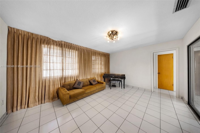 unfurnished living room featuring light tile patterned flooring