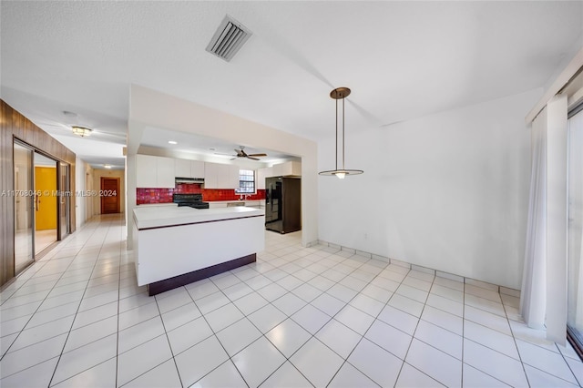 kitchen with tasteful backsplash, ceiling fan, black appliances, decorative light fixtures, and white cabinets