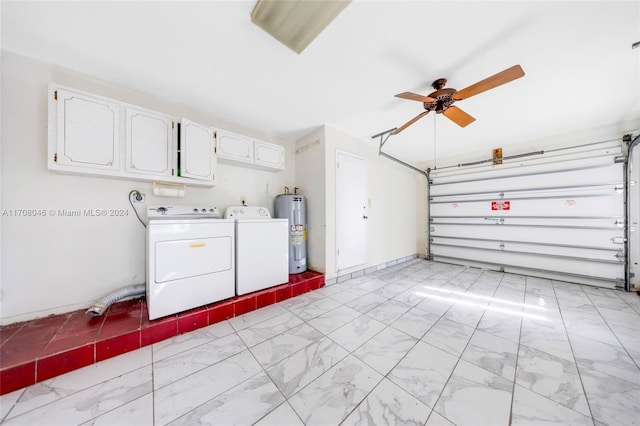 garage featuring washing machine and clothes dryer, ceiling fan, and water heater