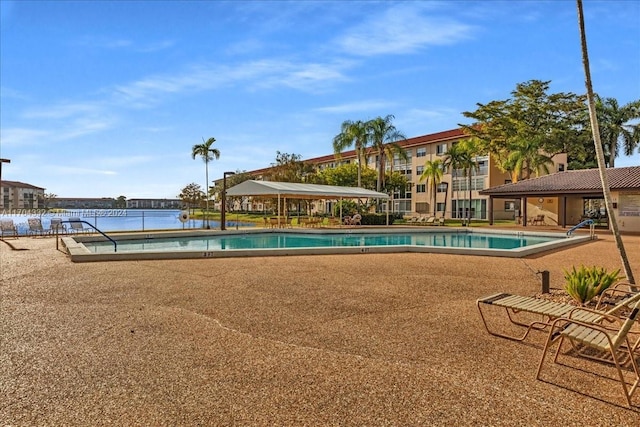 view of swimming pool with a water view