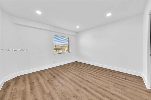 unfurnished room with light hardwood / wood-style flooring