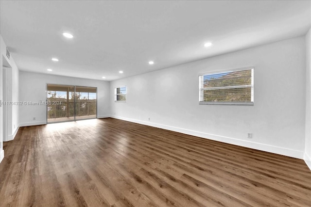 empty room featuring wood-type flooring