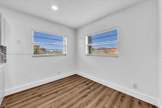 1200 SW 130th Ave Unit 412G, Pembroke Pines, FL 33027 - unfurnished room featuring baseboards, wood finished floors, and recessed lighting