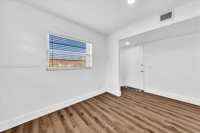 empty room featuring hardwood / wood-style flooring