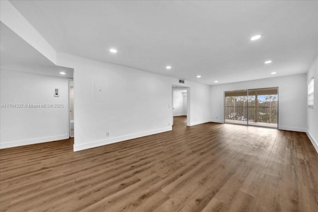 1200 SW 130th Ave Unit 412G, Pembroke Pines, FL 33027 - unfurnished living room featuring recessed lighting, baseboards, and wood finished floors