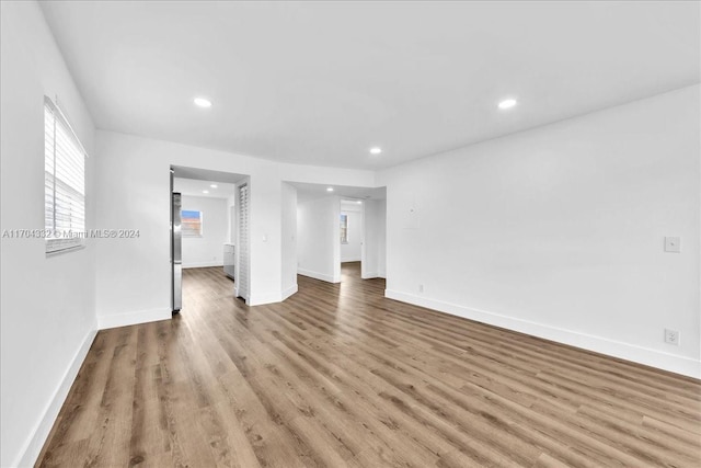 unfurnished living room with light wood-type flooring