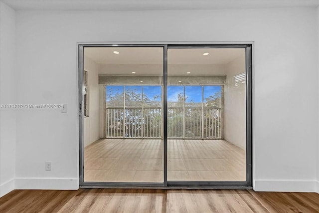 1200 SW 130th Ave Unit 412G, Pembroke Pines, FL 33027 - empty room with wood finished floors, healthy amount of natural light, baseboards, and recessed lighting