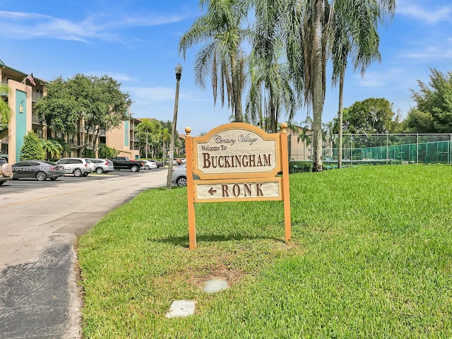 community sign with a lawn