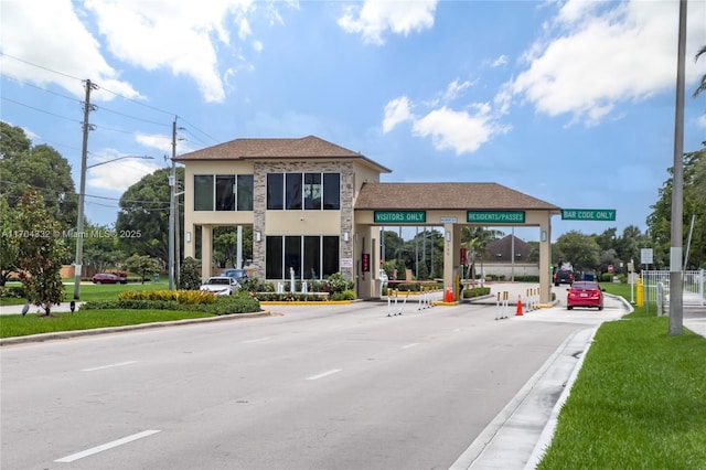1200 SW 130th Ave Unit 412G, Pembroke Pines, FL 33027 - view of asphalt street with street lights, curbs, and traffic signs