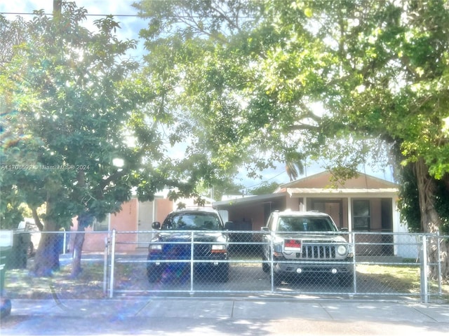 view of front of home featuring a carport