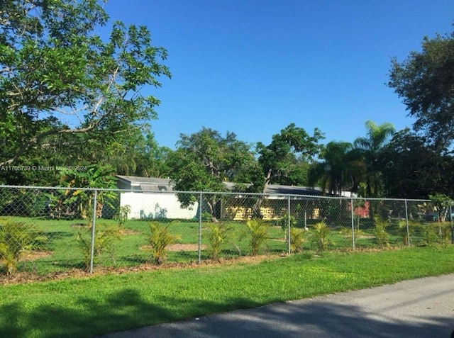 view of property's community with a yard