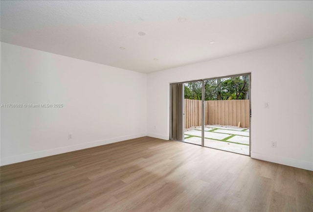 unfurnished room featuring light wood-type flooring