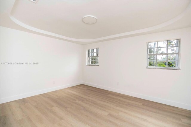 empty room with light hardwood / wood-style floors