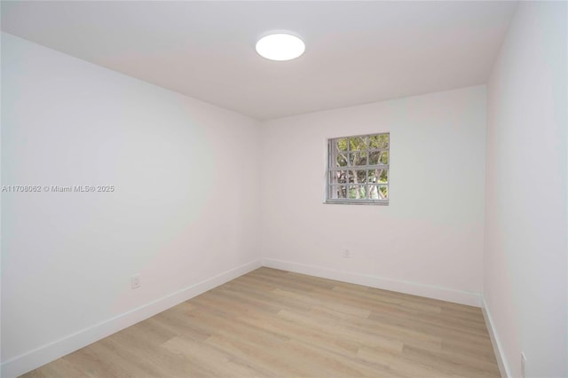 spare room with light wood-type flooring