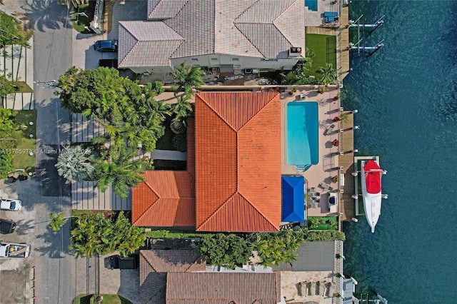 birds eye view of property with a water view